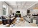 Spacious living area with large windows, coffered ceilings, and seamless access to the kitchen at 132 Olympic Pl, Decatur, GA 30030