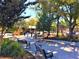 Scenic park view with benches, trees, and sculptures on a sunny day in a walkable community at 132 Olympic Pl, Decatur, GA 30030