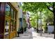 Charming street view with boutique shops, restaurants, and leafy trees, showcasing walkable neighborhood at 132 Olympic Pl, Decatur, GA 30030