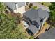 An aerial view of the home shows its spacious backyard with a firepit, patio, and screened-in porch at 4044 Kenway Se Pl, Smyrna, GA 30082