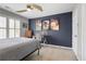 Inviting bedroom featuring space-themed artwork and a built-in desk area at 4044 Kenway Se Pl, Smyrna, GA 30082