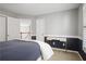 Bedroom featuring carpet flooring, a desk, and a comfortable bed at 4044 Kenway Se Pl, Smyrna, GA 30082