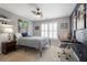 Cozy bedroom with a ceiling fan, desk area, and artistic wall decor at 4044 Kenway Se Pl, Smyrna, GA 30082