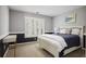 Bedroom featuring carpet flooring, a desk, and a comfortable bed at 4044 Kenway Se Pl, Smyrna, GA 30082