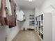 Organized walk-in closet with shelving, hanging rods, and ample storage space at 4044 Kenway Se Pl, Smyrna, GA 30082