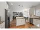 Modern kitchen features granite countertops, stainless steel appliances and open plan at 4044 Kenway Se Pl, Smyrna, GA 30082