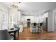 Eat-in kitchen with granite counters, stainless appliances and bright breakfast area at 4044 Kenway Se Pl, Smyrna, GA 30082