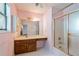 Bathroom with an extended vanity, white countertops, and a bathtub shower combo at 502 Knollwood Pl, Woodstock, GA 30188