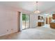 Open dining room with view of kitchen and sliding glass door that provides ample natural light at 502 Knollwood Pl, Woodstock, GA 30188