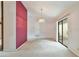 Spacious dining room with chandelier, sliding glass door, and access to kitchen at 502 Knollwood Pl, Woodstock, GA 30188