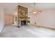Living room featuring a stone fireplace, light pink walls and carpeted floors at 502 Knollwood Pl, Woodstock, GA 30188