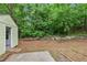 Backyard shed nestled among lush greenery in a spacious backyard setting at 502 Knollwood Pl, Woodstock, GA 30188