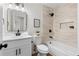 Modern bathroom with clean lines, sleek fixtures, and a bathtub with tiled surround at 7000 Woodland Nw Pl, Kennesaw, GA 30152