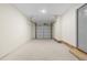Attached garage with a single overhead door and interior entry at 7000 Woodland Nw Pl, Kennesaw, GA 30152
