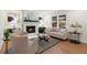 Inviting living room features a cozy fireplace, stylish decor, and comfortable seating arrangements at 7000 Woodland Nw Pl, Kennesaw, GA 30152