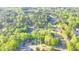 Beautiful aerial view of a home nestled in a lush, wooded neighborhood at 986 Franklin Ridge Ct, Sugar Hill, GA 30518