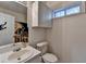 Bathroom with single sink vanity and overhead storage at 986 Franklin Ridge Ct, Sugar Hill, GA 30518