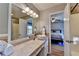 Bathroom featuring natural light, vanity with hard surface, tiled walls, and a shower with curtain at 986 Franklin Ridge Ct, Sugar Hill, GA 30518