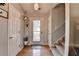 Inviting foyer with hardwood floors, stairs, and a stylish entryway decor at 986 Franklin Ridge Ct, Sugar Hill, GA 30518