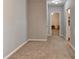 Hallway featuring neutral walls, neutral carpeting and doors to other rooms at 986 Franklin Ridge Ct, Sugar Hill, GA 30518