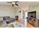 Comfortable living room with hardwood floors, a ceiling fan, and neutral walls at 986 Franklin Ridge Ct, Sugar Hill, GA 30518