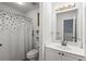 Bright bathroom featuring a single vanity and shower at 1156 Cotton Gin Ct, Lawrenceville, GA 30045