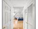 Hallway view into the bedroom, showcasing natural light and comfortable space at 1156 Cotton Gin Ct, Lawrenceville, GA 30045