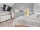 Large bedroom featuring ample closet space, natural light and wood-look flooring at 1156 Cotton Gin Ct, Lawrenceville, GA 30045