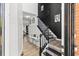 Elegant entryway with hardwood floors, decorative molding, and a staircase with stylish accents at 1156 Cotton Gin Ct, Lawrenceville, GA 30045