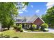 Charming brick two-story home with a landscaped front yard and welcoming curb appeal at 1156 Cotton Gin Ct, Lawrenceville, GA 30045