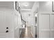 Bright hallway with white trim, modern decor, and access to a well-lit bathroom at 1156 Cotton Gin Ct, Lawrenceville, GA 30045