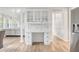 Bright work space featuring built in shelving with marble countertops, and white cabinetry at 1156 Cotton Gin Ct, Lawrenceville, GA 30045