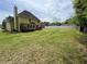 Expansive backyard with lush lawn and spacious deck, perfect for outdoor activities and relaxation at 2246 Carrington Dr, Ellenwood, GA 30294