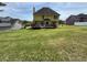 Expansive backyard with lush lawn and spacious deck, perfect for outdoor activities and relaxation at 2246 Carrington Dr, Ellenwood, GA 30294