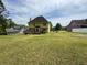 Expansive backyard featuring a deck, perfect for outdoor entertaining and relaxation at 2246 Carrington Dr, Ellenwood, GA 30294