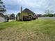 Expansive backyard with lush lawn and spacious deck, perfect for outdoor activities and relaxation at 2246 Carrington Dr, Ellenwood, GA 30294