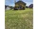 Expansive backyard with lush lawn and spacious deck, perfect for outdoor activities and relaxation at 2246 Carrington Dr, Ellenwood, GA 30294