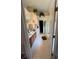Well-lit bathroom with white tile flooring, a double vanity, and a glass-enclosed shower at 2246 Carrington Dr, Ellenwood, GA 30294