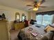 Bedroom with large window, desk, computer, and dresser providing ample space and functionality at 2246 Carrington Dr, Ellenwood, GA 30294