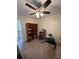 Bedroom featuring a ceiling fan and exercise equipment at 2246 Carrington Dr, Ellenwood, GA 30294