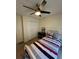 Comfortable bedroom features a ceiling fan and closet at 2246 Carrington Dr, Ellenwood, GA 30294