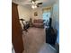 Functional bedroom featuring a small sofa, exercise equipment, and a wall-mounted television at 2246 Carrington Dr, Ellenwood, GA 30294
