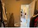 Walk-in closet providing access to a bedroom and featuring built-in shelving at 2246 Carrington Dr, Ellenwood, GA 30294