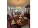 Traditional dining room boasts hardwood floors, chandelier lighting, and china cabinet at 2246 Carrington Dr, Ellenwood, GA 30294