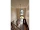 Beautiful chandelier and arched windows illuminate the entry foyer, creating a welcoming atmosphere at 2246 Carrington Dr, Ellenwood, GA 30294