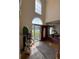 Grand foyer featuring soaring ceilings, hardwood floors, and abundant natural light at 2246 Carrington Dr, Ellenwood, GA 30294