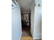 Cozy hallway leading to living areas with hardwood floors and stylish decor at 2246 Carrington Dr, Ellenwood, GA 30294