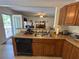 Open-concept kitchen featuring ample counter space and easy access to the outdoor patio at 2246 Carrington Dr, Ellenwood, GA 30294