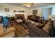 Comfortable living room with a brick fireplace, patterned sofas, and decorative touches at 2246 Carrington Dr, Ellenwood, GA 30294