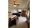 Comfortable main bedroom with a ceiling fan, TV, seating, and ample space for relaxation and rest at 2246 Carrington Dr, Ellenwood, GA 30294
